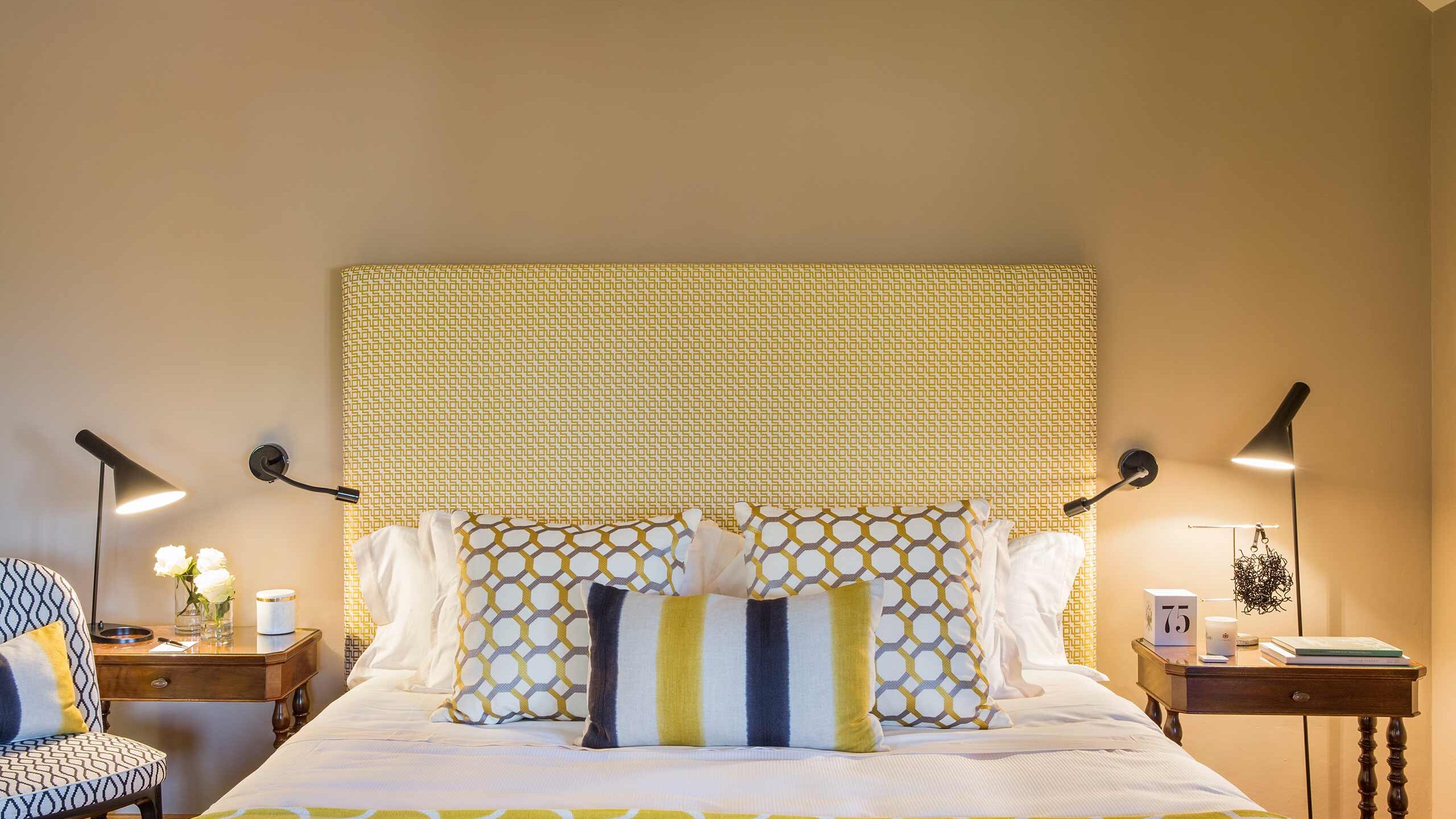 Bright Deluxe room with refined fabrics in a luxury hotel in Lombardy